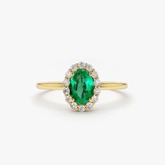 Emerald Ring / 14k Classic Oval Cut Emerald Ring with Surrounding Diamonds / Natural Emerald Ring in 14k Solid Gold / Mothers Day Gift Item Features * Made to Order. * Gold KT: 14K * Custom Gold Color: Rose Gold, Yellow Gold, White Gold * Number of Emeralds and Size : 1 Oval Emerald 6x4MM in Size * Number of Diamonds:  14 Round diamonds 1.30MM in Size * Total Emerald CTW: 0.40ctw * Total Diamond CTW: 0.15ctw * Diamond Color Clarity: G Color SI Clarity * Setting Type: Prong * Band Width: 1.25mm * Ready to Ship in 7-10 Business Days ▶ See more of our Emerald Jewelry - https://etsy.me/3QCyZBQ ▶ See our storefront here - http://etsy.me/2lUcVnH  ▶ All store sections here * Diamond Rings - http://etsy.me/2lwKUl8 * Diamond Earrings - http://etsy.me/2lyqVBP * Diamond Necklace - http://etsy.me/2mqa 14k Gold Emerald-cut Halo Cluster Ring, 14k Gold Emerald-cut Cluster Ring With Halo Design, 14k Gold Emerald Cut Cluster Ring With Halo Design, 14k Gold Emerald Cut Halo Cluster Ring, Oval Halo Ring For Formal Occasions, Heirloom Yellow Gold Diamond Ring With Oval Cabochon, Formal Oval Cluster Ring With Halo Design, Heirloom Halo Ring With Round Band, Heirloom Halo Round Ring