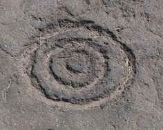 a circle made out of dirt on the ground