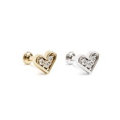 A beautiful flat back stud earring to add to your cartilage. With a cute heart design, this unique stud is crafted from 14k solid gold and prong set with a round-cut diamond totaling 0.03 carats. It's minimalist and totally chic. You'll love wearing it!  The threaded screw pin earring post is easy to insert and remove, and the flat back makes it comfortable to wear. Our screw pin flat back earring studs are made of solid 14k gold and are hypoallergenic and nickel free. Materials: * 14k solid gol Elegant Heart-shaped Cartilage Earrings As Gift, Elegant Heart Shaped Cartilage Earrings As Gift, Elegant Heart-shaped Single Cartilage Earring, Elegant Silver Heart Piercings, Heart Charm Piercings As Gift, Heart-shaped Piercings With Heart Charm For Gift, Heart Charm Piercings For Gift, Heart-shaped Internally Threaded Cartilage Earrings As Gift, Heart-shaped Sterling Silver Piercings As Gift