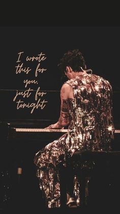 a woman sitting on top of a piano in front of a quote that reads, i wrote