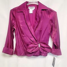 Vintage Ronnie Nicole Shimmery Faux Wrap Fushia Evening Blouse With A Rhinestone Bow. Shimmering Fuschia Purple 75% Rayon, 25% Polyester 10" Side Zipper Laid Flat, The Approx Measurements Are: Chest: From Armpit To Armpit, 17" Across. Length: From Bottom Of Back Collar To Hem 2.5" Long. Sleeve Length: From Shoulder Seam To End Of Sleeve 24" Long. Bp33 Evening Blouses, Light Pink Tops, Knotted Blouse, Mesh Blouse, Wrap Crop Tops, Balloon Sleeve Blouse, Rhinestone Bow, Flowy Blouse, Puff Sleeve Blouse