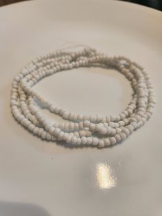 "Obatala Santeria Bead Necklace, Collares, Eleke ,Elekes Collares, Eleke Necklaces, Yoruba Religion, Santeria, Ifa, Orisha, Ekes, Orisha Necklace Length vary from 14\" - 17\" Made from glass seed beads Made with all white beads. Items sold are not washed or blessed." White Jewelry With Wooden Beads, White Jewelry With Round Wooden Beads, White Multi-strand Wooden Beaded Necklaces, White Multi-strand Beaded Necklace With Wooden Beads, White Multi-strand Necklace With Wooden Beads, White Rondelle Beaded Jewelry, White Rondelle Bead Jewelry, White Rondelle Jewelry With Tiny Beads, White Necklaces With Tiny Beads