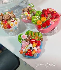 three small bowls filled with different types of candies