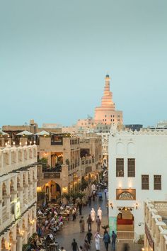 people are walking around in an old city