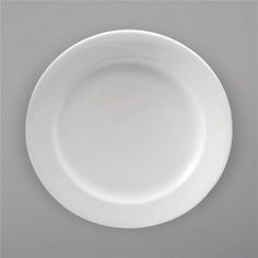 an empty white plate on a gray background