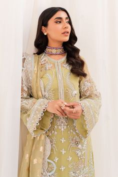 Pakistani Embroidered Kameez Crushed Sharara Yellow Wedding Dress has the perfect balance of style and grace. This masterpiece comes in premium quality fabric and is adorned with threads, mirror details, and cutwork, making it an epitome of beauty and elegance. Embroidered Kameez: The wedding dress kameez has a beautiful yellow color. Hand-crafted details of dabka, motifs, and pearls give a glamorous look to this yellow kameez. Mirror details, threads, and cutwork give a perfect finish to the ka Organza Lawn Suit With Intricate Embroidery For Reception, Intricately Embroidered Georgette Dress For Wedding, Embroidered Georgette Dress With Dupatta For Wedding, Resham Embroidered Dress For Wedding And Diwali, Wedding Embroidered Georgette Dress With Dupatta, Pista Green Organza Dress For Wedding, Designer Embroidered Georgette Dress For Eid, Eid Embroidered Dress In Georgette, Bollywood Style Embroidered Dress For Wedding And Eid