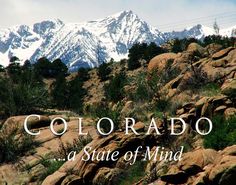 the words colorado state of mind are in front of some rocks and grass with mountains in the background