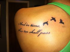 a woman with a tattoo on her shoulder that says and in time, this too shall pass