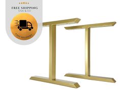 two gold metal stands with a free shipping label on top and an image of a delivery truck in the background