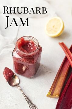 there is a jar of jelly next to some rhubars and lemon slices