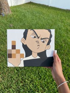 a person holding up a piece of paper with an avatar on it