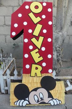 a mickey mouse number one sign on the side of a building