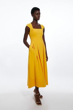 Feel Elegant In Our Midi Dress, With A Universally Flattering Silhouette, A Long Skirt That Creates Flowing Movement, And A Square Neckline, Perfect For Getting A Little Dressed Up. Style This Dress With Strappy Heels For An Outfit That Will Turn Heads From Wedding Guest Days To Upcoming Occasions And Events. Compact Stretch Tailored Square Neck Full Skirted Midi Dress High Quality, Stretch Fabric Formal, Flowing Skirt Flattering Fit And Flare Silhouette Square Neckline Short Capped Sleeves Midi Yellow Square Neck Dress, Taurus Fashion, Pencil Dresses Work, Yellow Skirts, Dresses Business Casual, Wrap Dresses Summer, Spring Bridesmaid Dresses, Summer Bridesmaid Dresses, Spring Wedding Guest Dress