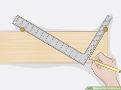 a person holding a ruler and pencil in front of a piece of wood that has been cut