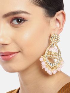 These beautiful light-pink dome shaped jhumka earrings come with kundan stone studs & beads, are gold-plated and are secured with a post and back closure. These handcrafted jhumkas can complement any traditional outfit to add a punch of subtle color, and help you stand out. Product color may vary based on the monitor or screen you are using.See FAQ for more details. Size Length: 9.5 cm Details Material: BrassStones: Kundan & Artificial BeadsPlating: Gold-plated Gold Kundan Beaded Earrings, Festive Kundan Beaded Earrings With Latkans, Festive Bollywood Kundan Beaded Earrings, Anarkali Style Kundan Jhumkas, Festive Kundan Chandbali Beaded Earrings, Festive Kundan Beaded Chandbali Earrings, Pink Round Jhumkas For Festivals, Pink Jhumkas For Festivals, Festive Bollywood Chandbali Beaded Earrings