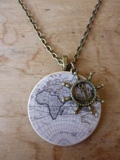 a necklace with a world map on it