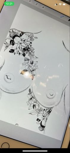 an image of a woman's face with flowers painted on the back of it