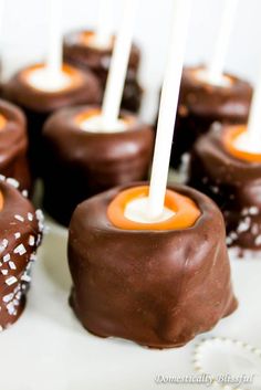 chocolate covered candies with orange and white candles