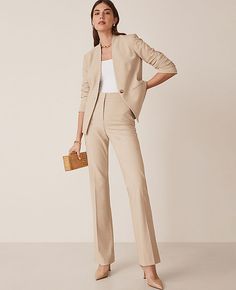 Elevate your wardrobe with the Ann Taylor Petite High Rise Skinny Trouser Pant in Bi-Stretch, a perfect blend of style and comfort. These trousers are meticulously tailored to flatter your figure while providing all-day comfort, thanks to their refined four-way stretch fabric.

- **Size:** Petite 12
- **Color:** Toasted Oat
- **Material:** 66% Polyester, 28% Rayon, 6% Spandex
- **Gender:** Female
- **Fit:** Tailored and fitted
- **Rise:** High rise, sits 1/2" to 1" below natural waist
- **Leg Sh Womens Tan Suit Work Outfits, Women’s Work Attire, Ann Taylor Work Outfits, Women’s Trousers, Women’s Work Wear, Khaki Suit Women, Flare Dress Pants Outfit, Beige Suits Women, Women’s Suits