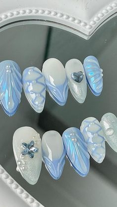 Futuristic Nail Art Designs, Blue Aesthetic Nails Almond, Iridescent Nails Blue, Blue Coquette Nails, Cinderella Nail Art, Soft Blue Nails, Blue Mermaid Nails, Aquatic Nails, Jellyfish Nail Art