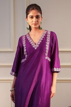 Purple kurta featuring mirror hand embroidery and a v-neckline. Paired with a pant. - Aza Fashions Navratri V-neck Mirror Work Sets, Festive Gota Work Sets With V-neck, Diwali V-neck Sets With Mirror Work, Festive Embroidered V-neck Kurta, Navratri Embroidered V-neck Dupatta, Festive V-neck Palazzo Set For Festivals, V-neck Mirror Work Set For Festivals, V-neck Sets With Mirror Work For Festivals, V-neck Festival Sets With Mirror Work