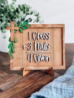 a wooden sign with the words i cross and 3 nails 4 given in white lettering