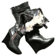 Incredibly rare iconic pair of boots by Balenciaga by Nicolas Ghesquiere from the fall winter 2004 runway collection Black and brown leather Entirely lined in ivory shearling fur Exposed zip, poppers and buckles in silver Black glossed perspex style wedge platform heel There are several ways to wear these which makes them entirely unique. You can wear them fully unzipped which flares the boots out to show off the inner shearling, you can wear them fully done up, half done up, or with the top pop Ghesquiere Balenciaga, Tennis Shoe Heels, 2004 Runway, Wedges Boots, Balenciaga Boots, Woman In Suit, Wedge Heel Boots, Platform Wedge Heels, Nicolas Ghesquiere