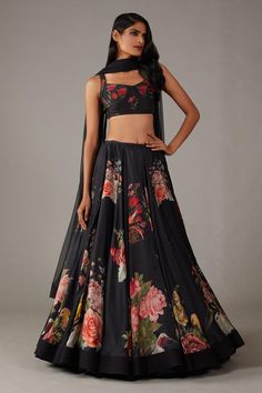 Black flared lehenga with musk bloom print. Paired with sleeveless sweetheart neckline  corset style blouse and dupatta.
Components: 3
Pattern: Print 
Type Of Work: Musk Rose Print
Neckline: Sweetheart Neck
Sleeve Type: Sleeveless
Fabric: Modal and Chanderi, Lining: Silk
Color: Black
Other Details: 
Note: The cancan skirt worn by the model is not for sale
Occasion: Destination Wedding, Sangeet - Aza Fashions Black Satin Lehenga, Editors Note, Satin Lehenga, Print Lehenga, Musk Rose, Lehenga Crop Top, Printed Lehenga, Rohit Bal, Red Lehenga