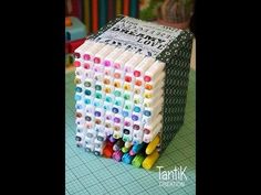 a stack of markers sitting on top of a table