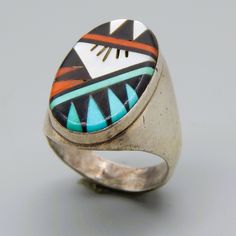 META  SILVER METAL STAMP/HALLMARK  SIGNED LGL ZUNI SIZE  12 WIDTH (inches/mm)  1.14 / 29.06 WEIGHT ( gram )  20.3 Multicolor Oval Inlay Rings, Oval Multicolor Rings For Collectible, Oval Multicolor Rings For Collectors, Oval Multicolor Rings With Inlay, Southwestern Oval Multi-stone Rings, Southwestern Style Oval Multi-stone Rings, Southwestern Style Multicolor Oval Rings, Retro Oval Collectible Rings, Retro Oval Rings For Collectors