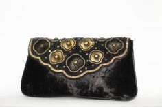 Classic vintage look of this beautiful handbag will add a touch of persona and charm. This clutch bag for wedding is made up of intricately designed victorian pattern with crystal embellishments on the middle of floral decoration. This bag is unique and stands different from wedding clutches that are currently in the market. This handbag is a timeless piece of art covered in velvet fabric. Wedding Clutch Bag, Victorian Pattern, Pouch Handmade, Clutch Bag Wedding, Beads Charm, Wedding Clutch, Beautiful Handbags, Floral Decoration, Wedding Fabric