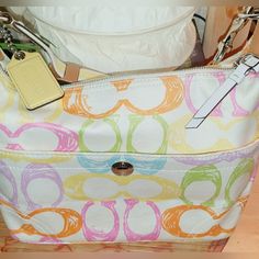 Coach Hampton Pastel Scribble Cotton Cc Hobo Shoulder Bag Like New- No Stains Or Odor Clean. Coach Code In Photo Non-Smoker Bag Is Approx. 15” Long, 9” High, 5” Wide, 8” Depth, Strap Drops 10 1/2” Pink Yellow, Coach Bags, The Hamptons, Like New, Bag Lady, Pastel, Shoulder Bag, Yellow, Pink