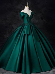 Radiate timeless elegance in our Gothic Emerald Green Off-Shoulder Ball Gown with Cinched Waist - Satin Evening Dress Plus Size. This breathtaking gown boasts a classic off-shoulder neckline that gracefully exposes the décolletage, coupled with a sweeping full skirt that adds a dramatic flair to every step. The gown's Green Off-shoulder Gown For Wedding, Green Formal Ball Gown With Fitted Bodice, Formal Green Ball Gown With Fitted Bodice, Green Ball Gown With Fitted Bodice For Formal Occasions, Green Off-shoulder Formal Gown, Formal Satin Ball Gown With Ruffles, Elegant Green Off-shoulder Ball Gown, Elegant Off-shoulder Green Ball Gown, Banquet Ball Gown With Pleated Bodice