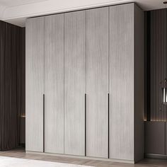 a large white closet with sliding doors in a living room next to a wall mounted light