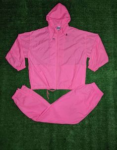 "Vintage 90's Windbreaker Hoodie Jacket And Pants Outfit. Has light marks on back of jacket. NO holes. In good vintage condition... Ready To Wear!! Jacket Size XL. Pants Size L. Jacket Measurements: Pit to Pit: 25 3/4\" Collar to Bottom: 28 3/4\" Pit to End of Sleeve: 18 1/2\" Pants Measurements: Waist to Bottom: 44\" Crotch to Bottom: 31\" Leg Opening: 4 3/4\"" Hooded Tracksuit For Spring Streetwear, Hooded Tracksuit For Streetwear In Spring, Spring Tracksuit With Drawstring Hood For Streetwear, 90s Pink Windbreaker For Streetwear, 90s Hooded Windbreaker For Spring, 90s Style Hooded Spring Windbreaker, 90s Hooded Spring Windbreaker, 90s Style Windbreaker With Pockets For Spring, Pink Tracksuit With Drawstring Hood For Streetwear