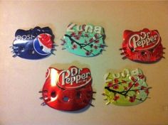 four different kinds of soda bottle caps on a wall