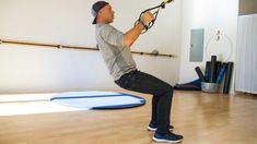 a man is doing an exercise with a rope