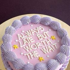 a birthday cake with purple icing and white frosting that says always late but worth the wait