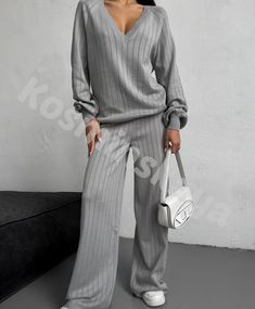 Gray hollow out knitted pantsuit is incredibly stylish and comfortable!  Our suit is knitted from natural cotton yarn with the addition of viscose, pleasant to the touch and to the body, consists of a deep V neck sweater and straight fit pants.  The suit can be worn anywhere, as an elegant casual for every day, walking, shopping, traveling and much more.   DETAILS  - beige - 80% cotton, 20% viscose  - knitted pattern  - loose fit  - deep V neck - straight fit pants   SIZES   This suit is available in 3 sizes XS-S,  M-L and XL-XXL  Dropped sleeve 31.5"/ 80 cm  Back length 25.6"/ 65 cm  Pants length 42.9"/ 109 cm  Inseam 30.7"/ 78 cm Size  XS - S  bust 84-88cm = 33.08-34.64 inches,  waist 63-67cm = 24.8 - 26.37 inches  hips 92-96 = 36.22-37.80 inches.   M-L BUST 36-37.7 inches / 92-96 cm WAI Deep V Neck Sweater, Straight Fit Pants, Suit For Women, Knitted Suit, Pants Suit, Fit Pants, Sweater Pants, Suit Set, 2 Piece Set