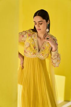 Editor's Note Radiate joy and charm in our yellow chiffon multi-colored embroidered net full-length anarkali. Adorned with vibrant embroidery, it exudes a festive vibe. Paired with an embroidered net dupatta featuring organza frills, this ensemble is a perfect choice for celebratory occasions. Step into the spotlight with this vibrant and elegant outfit. Fabric: Anarkali: net/chiffon, dupatta: net/organza Color: Yellow Components: Anarkali and dupatta Occasion: Festive and haldi mehndi Note: Pro Luxury Yellow Anarkali Set For Eid, Luxury Anarkali Chiffon Gown, Luxury Yellow Anarkali Set For Reception, Luxury Yellow Anarkali Set With Embroidered Border, Luxury Yellow Banarasi Silk Anarkali Set, Luxury Sleeveless Anarkali Set With Resham Embroidery, Luxury Anarkali Gown In Tissue Silk, Luxury Resham Embroidered Anarkali Set For Summer, Luxury Yellow Traditional Wear With Embroidered Border