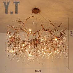 a chandelier hanging from the ceiling in a room