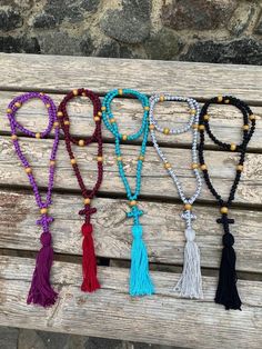 Discover the essence of spiritual devotion with our meticulously crafted Pocket Prayer Rope, available in both 30 and 50 knot variations, each adorned with a delicately braided cross. Our Orthodox Prayer Rope, also known as Komboskini or Chotki, is meticulously crafted to the highest standards. It features a precise distance of 10 knots between wood dividers, ensuring a seamless experience of prayerful meditation. Experience premium quality in every detail - from the tight, expert weaving to the Adjustable Bohemian Mala For Blessings, Adjustable Spiritual Mala For Festivals, Spiritual Hand Knotted Beaded Necklaces For Festivals, Spiritual Hand Knotted Beaded Necklace For Festivals, Meditation Rosary With 108 Beads, Hand Knotted Adjustable Spiritual Beads, Bohemian Beaded Rosary For Meditation, Adjustable Hand Knotted Beads For Meditation, Handmade Adjustable Mala For Festivals