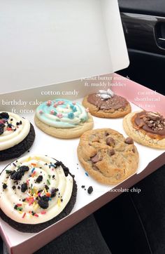 an open birthday cake box filled with cookies