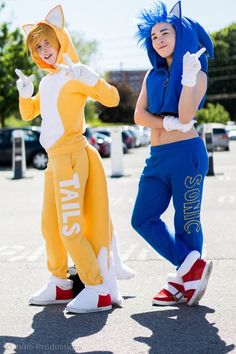 two people in costumes standing on the street