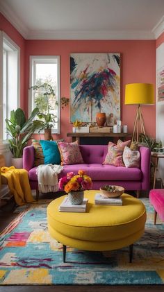 a living room with pink walls and yellow furniture in the center, colorful rugs on the floor