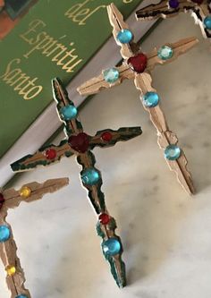 three wooden crosses sitting on top of a table