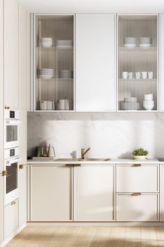 the kitchen is clean and ready for us to use it's white cabinetry