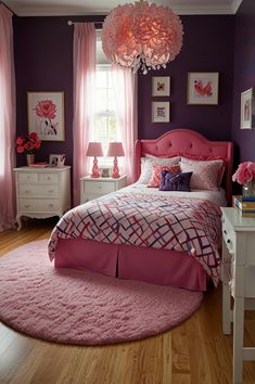 a bedroom decorated in pink and purple with flowers on the bed, chandelier