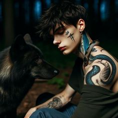 a man with tattoos sitting next to a dog