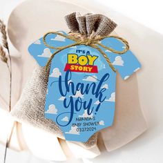 a boy baby shower thank you tag hanging from a chair